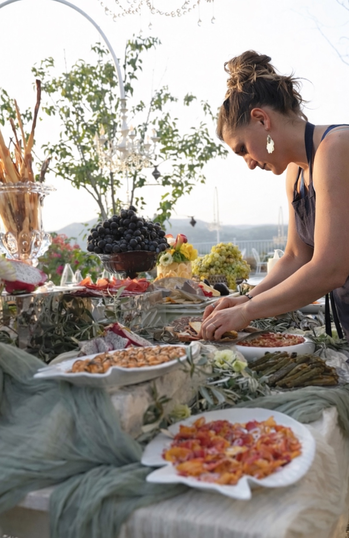 Seasonal shared table with cheese, fruit and flowers at Chef's Atelier